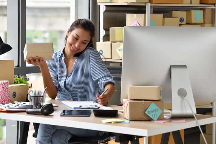 digital marketing diploma grad working in her office.