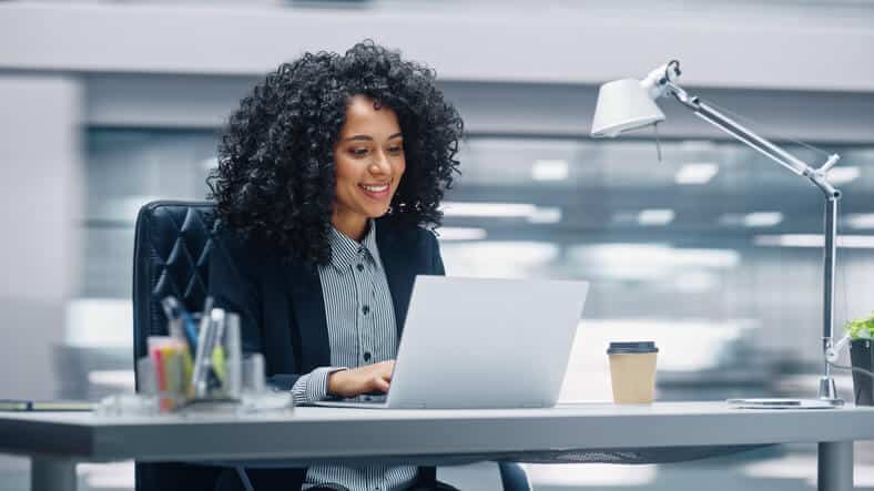 digital marketing program grad working at a desk