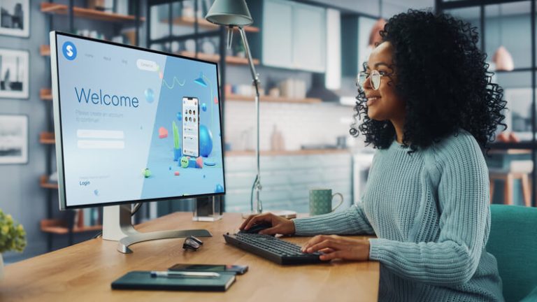 A focused digital marketer working in an office after completing her digital marketing course in Canada