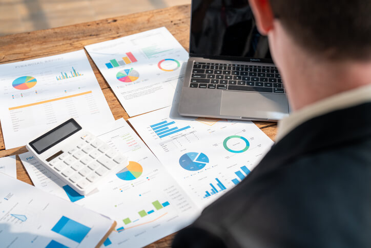 A male marketing data analyst working in an office after completing his digital marketing training