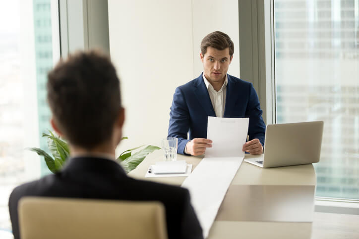 A male marketing data analyst in an interview with a potential employer after completing his digital marketing training