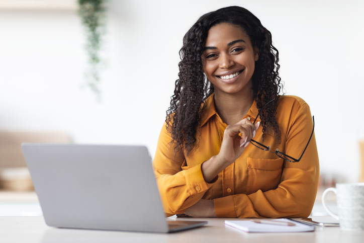 Female digital marketing professional working on a computer after her digital marketing diploma